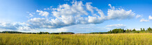 Panoramic View Of Clouds And Meadow