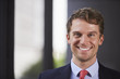 © Monkey Business - Young white businessman smiling, close up