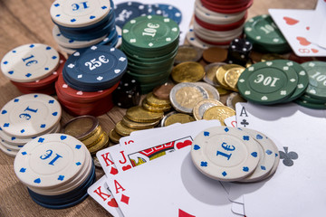 poker card, chips and coin on desk.