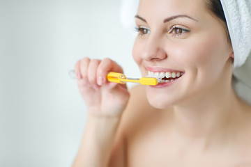 Wall Mural - Woman brushing her teeth 