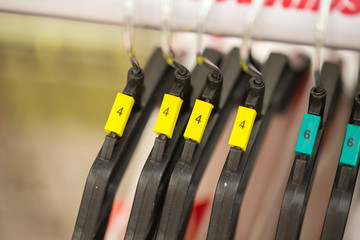 close up of clothes hanger with number color sizing label.