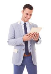 Wall Mural - Businessman using tablet pc. Isolated over a white background