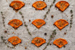 Slices of baked pumpkin with spices and herbs flat lay. Closeup of prepared spiced squash on cooking parchment. Seasonal , healthy food, vegetarian menu , real cuisine concept