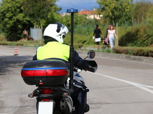 Policeman With Helmet On The Police Motorcycle