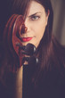 Portrait of cello player with beautiful red lips and green eyes