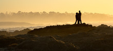Young Couple At Sunset At Asilomar State Beach Near Monterey, Ca