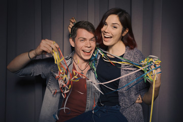 Wall Mural - Happy couple in love in a photo booth