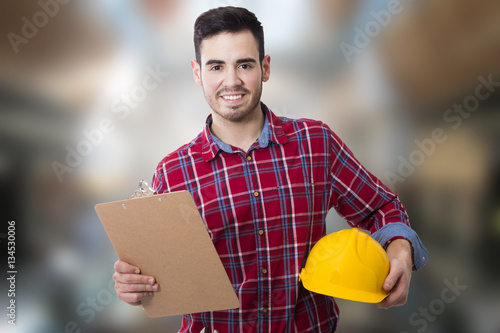 Fotografía the construction worker and technician on background