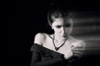 © tugolukof - beautiful woman portrait with blurred motion effect monochrome