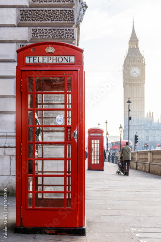 Fototapeta na wymiar Traditional London red phone box and Big ben in early morning