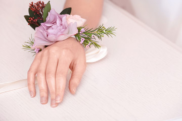 Wall Mural - Beautiful boutonniere on female hand, closeup