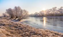 Beautiful Winter Scenery With Trees Covered By Frost, Along Frozen River