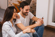 © bnenin - Happy couple with smartphone