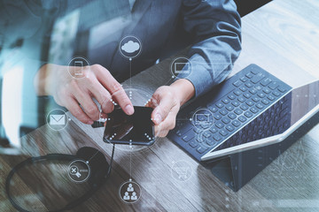 Poster - top view of man hand using VOIP headset with digital tablet comp