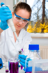 Scientist loads sample into plastic tube