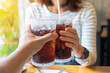 Men and Woman hand giving glass of cola.Glass of cola ,Soft drink