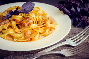 Sticker - Pasta with meatballs on wooden background