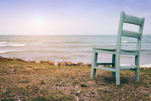 Vintage Tone Image Of A Chair In Front Of The Sea With Feeling Lonely