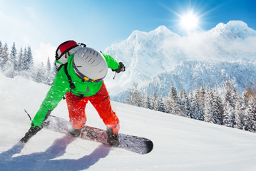 Wall Mural - Snowboarder running downhill