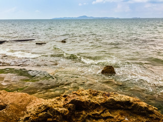 Wall Mural - Clear Pattaya Sea water with Koh Larn and blue sky in background