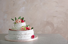 Delicious Wedding Cake On Table And Grey Textured Background