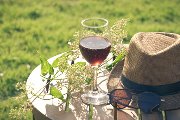 Glass of wine on the table  in park