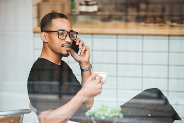 Portrait of a young afro american man in eyeglasses