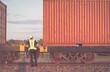Engineering working  in front of cargo loading workplace, Freight train