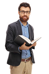 Canvas Print - Bearded man holding a book isolated on white background