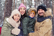 © ArtFamily - Young Caucasian family smiling waving to camera and having fun o