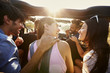 © Monkey Business - Five friends travelling together on a road trip in a car