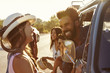 © Monkey Business - Friends on a road trip make a stop in their camper van