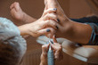 © AlexR - Podiatry procedure with pedicure machine. Care of the feet