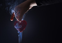Male Hand With Decorative Valentines Day Red Heart In Smoke