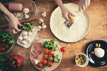 Wall Mural - Woman preparing pizza