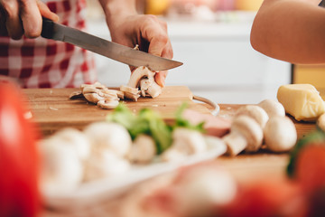 Wall Mural - Woman slicing mushroom