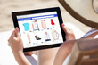 © Andrey Popov - Woman Doing Online Shopping On Digital Tablet