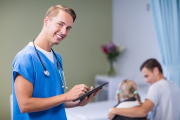 Sticker - Portrait of doctor using digital tablet