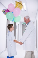 Canvas Print - Doctor walking with patient