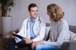 © WavebreakMediaMicro - Doctor discussing a medical report with woman
