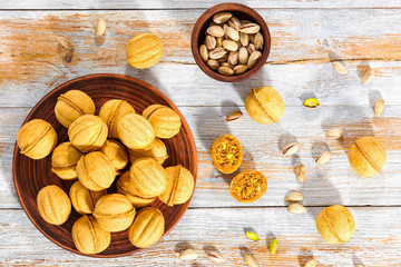 Wall Mural - Walnut shaped sweet cookies stuffed with condensed milk