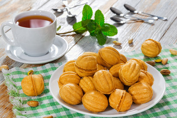 Wall Mural - Walnuts Shape Sweet Homemade Cookies with sweet condensed milk f