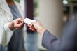 © WavebreakMediaMicro - Business executives exchanging business card