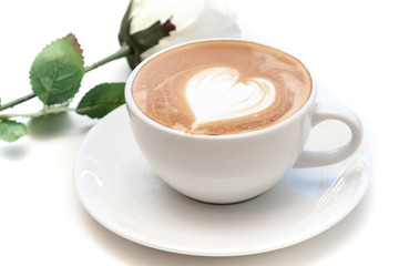 Wall Mural - Coffee cup of heart shape latte art on the plate with white rose