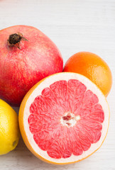 pomegranate, orange, lemon, grapefruit closeup