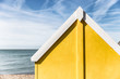 Yellow beach hut in Kent, England on summer day