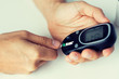 © Syda Productions - close up of man checking blood sugar by glucometer