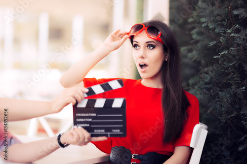 Fotografia, Obraz Surprised Actress with Oversized Sunglasses Shooting Movie Scene