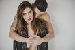 © ADDICTIVE STOCK - Man embracing girlfriend with passion