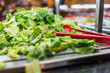 Lettuce in salad bar with red plastic tongs